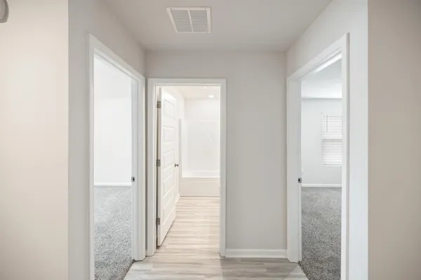 a view of a bathroom from the hallway