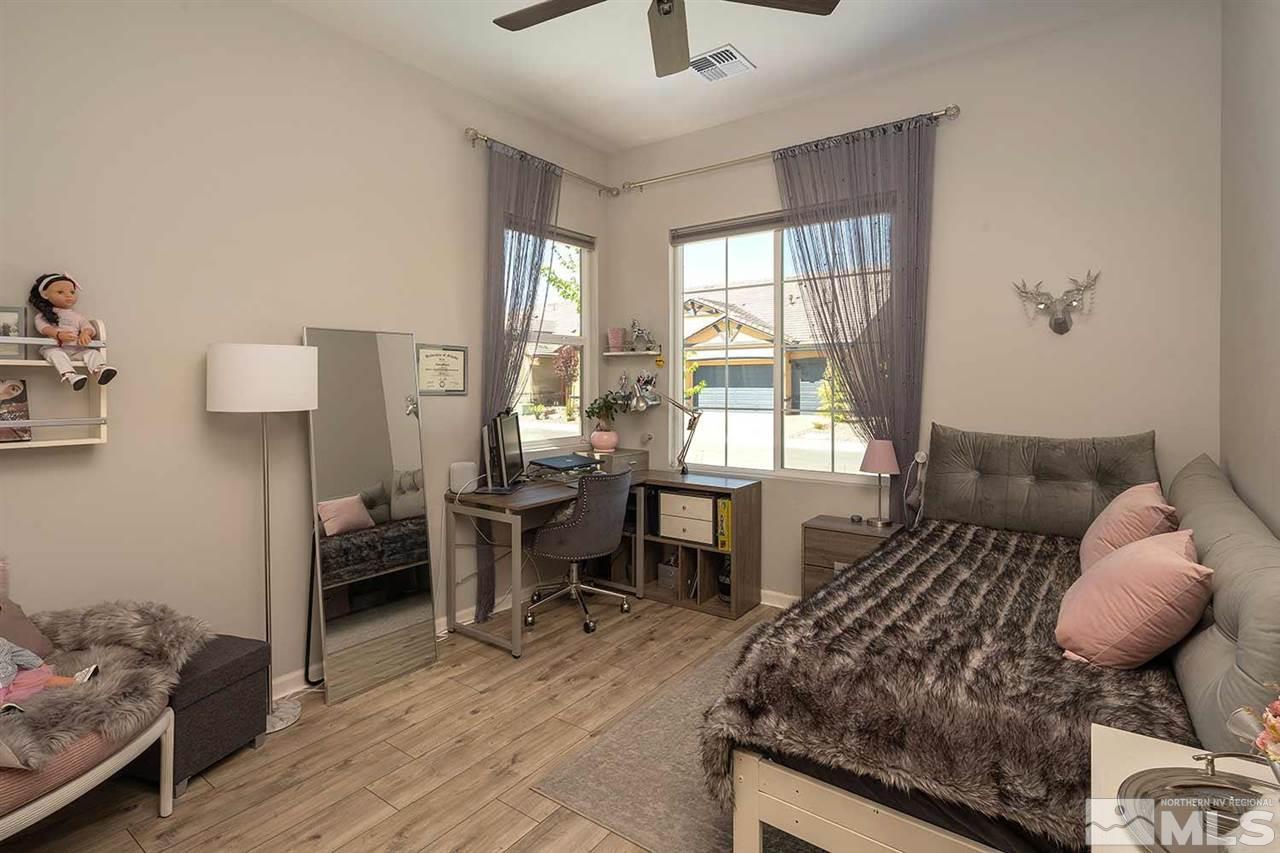 9404 Hawkshead Road Reno, NV 89521 - Photo 12 of 22 a living room with furniture and wooden floor