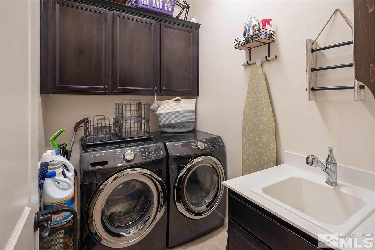 9404 Hawkshead Road Reno, NV 89521 - Photo 22 of 22 a utility room with dryer and washer