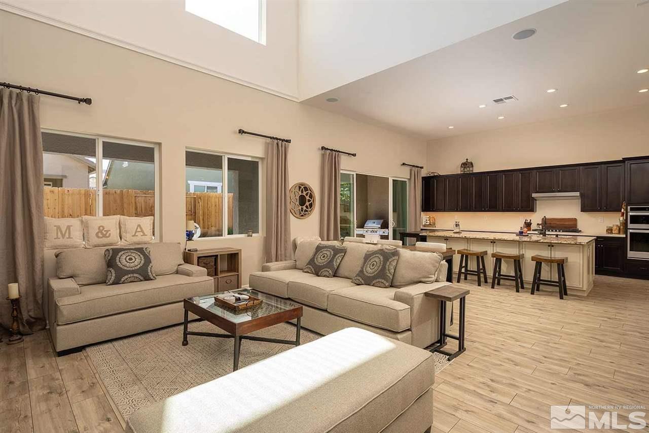 9404 Hawkshead Road Reno, NV 89521 - Photo 3 of 22 a living room with furniture and view of kitchen