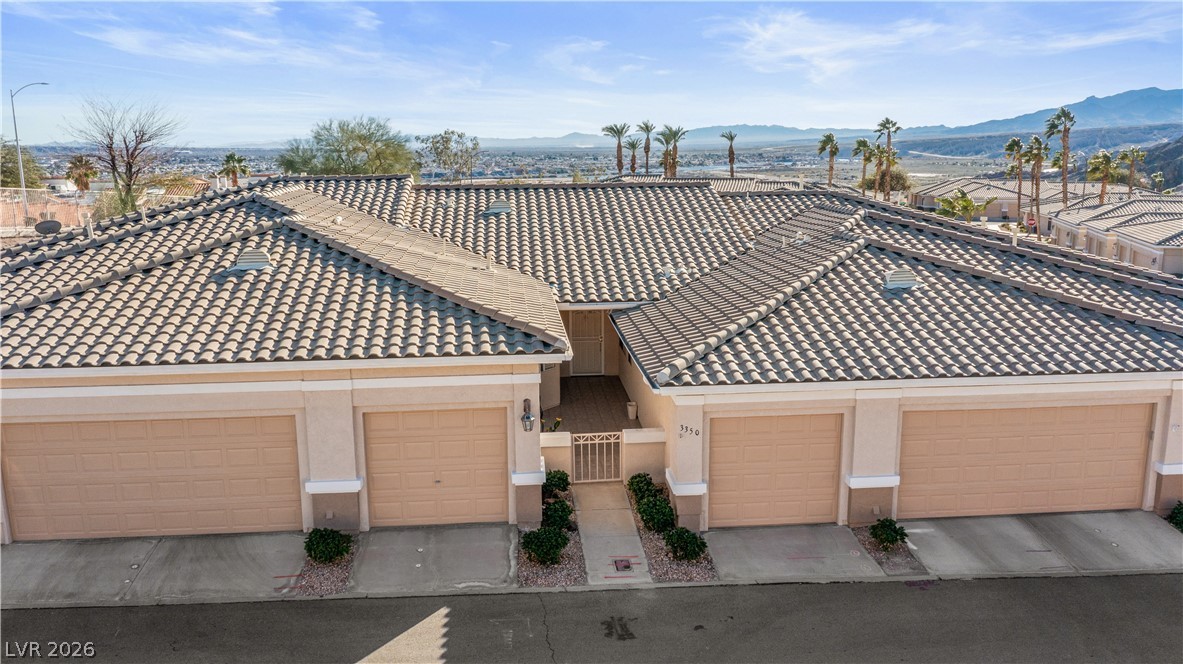 3350 Pheasant Canyon Way, Unit 1008 Laughlin, NV 89029 - Photo 73 of 80 View of front facade with stucco siding, a tile roof, and a garage