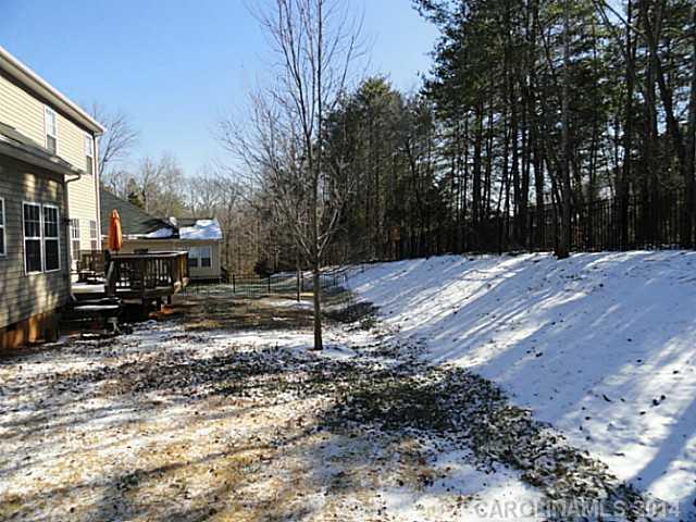 7155 Meyer Road Fort Mill, SC 29715 - Photo 13 of 14 a view of a yard with wooden fence