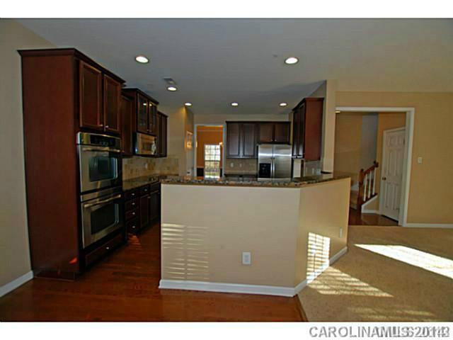 7155 Meyer Road Fort Mill, SC 29715 - Photo 5 of 14 a view of kitchen with stainless steel appliances granite countertop a refrigerator a sink a stove and oven