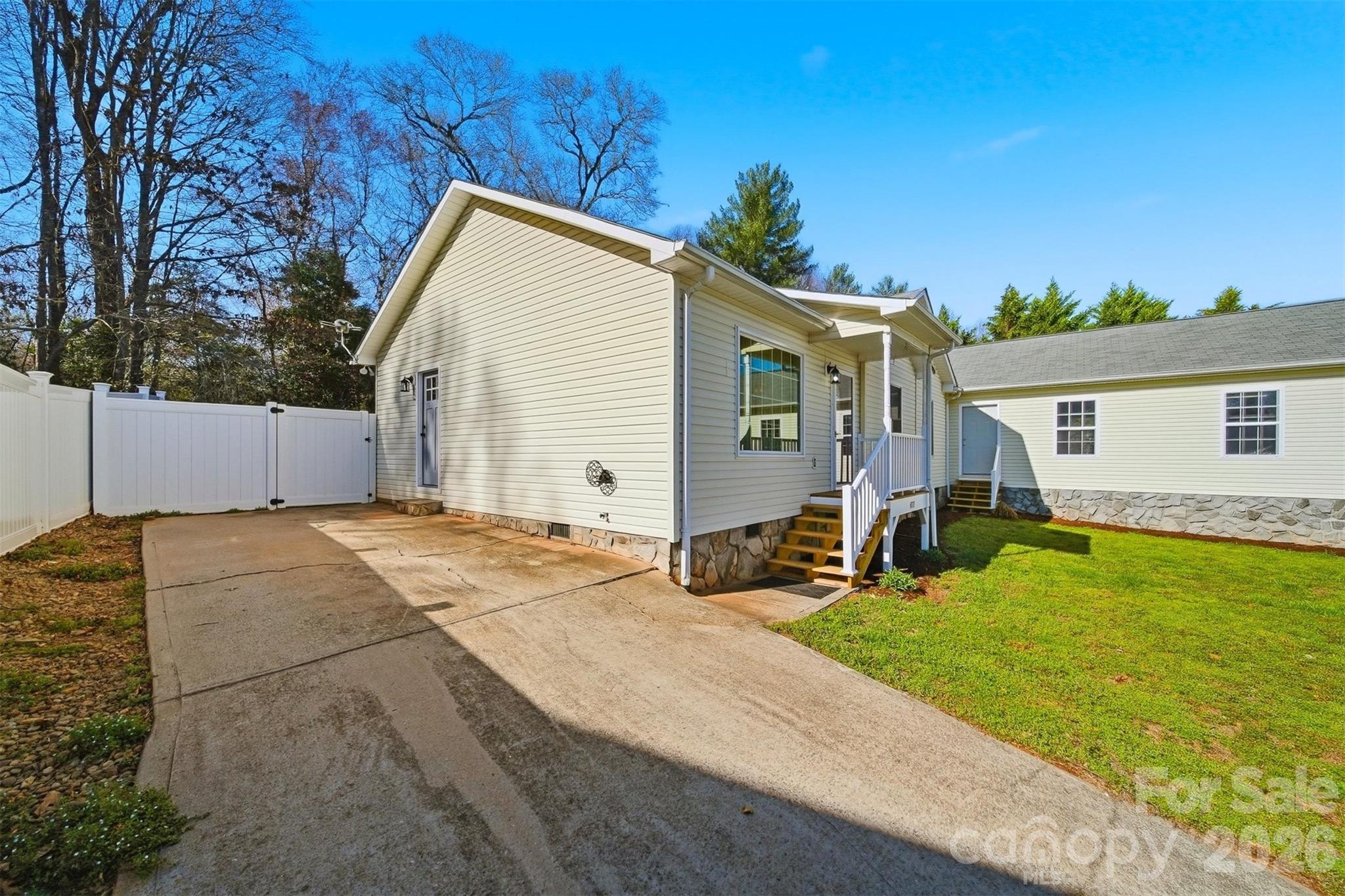 4771 Petra Mill Road Granite Falls, NC 28630 - Photo 2 of 46 a backyard of a house with yard and outdoor seating