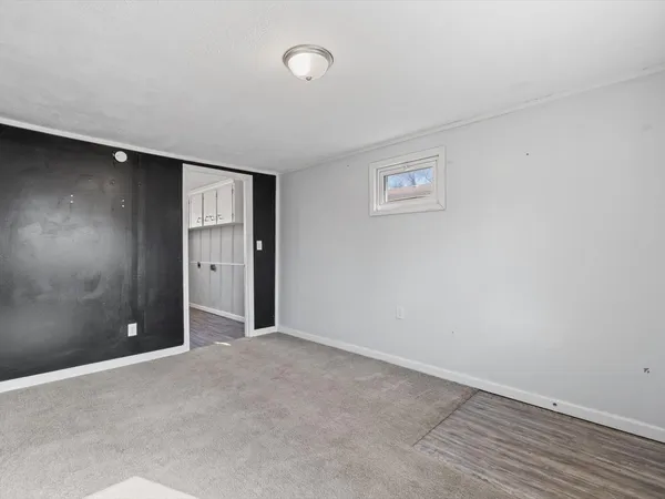 an empty room with closet area and closet