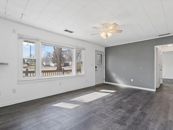 a view of an empty room with a window