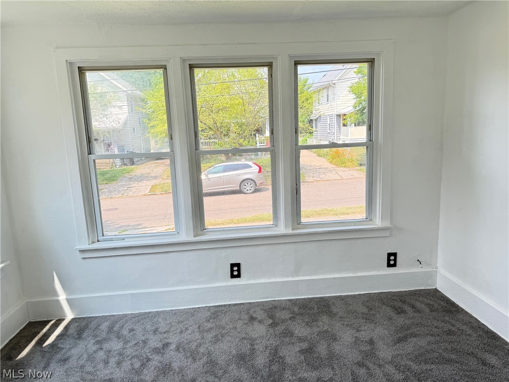 459 Patterson Avenue Akron, OH 44310 - Photo 14 of 24 1st floor apt. Carpeted bedroom room with a healthy amount of sunlight