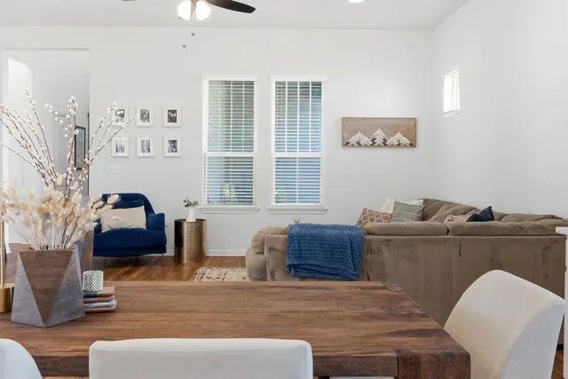 a view of a livingroom with furniture and a window