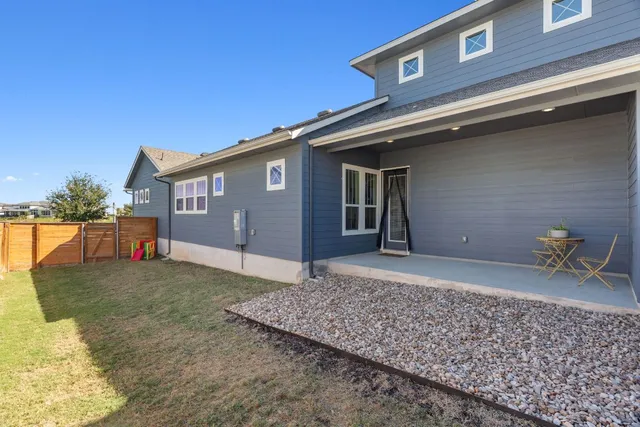a view of a lounge chair in the front of a house