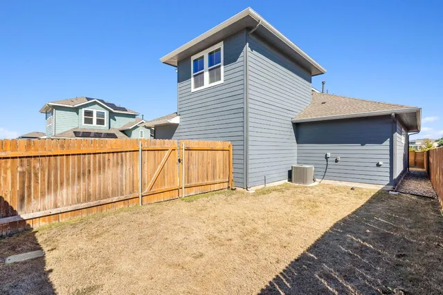 a house view with a backyard space