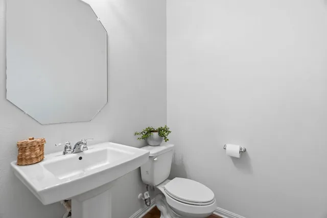 a front view of a house with a wooden fence