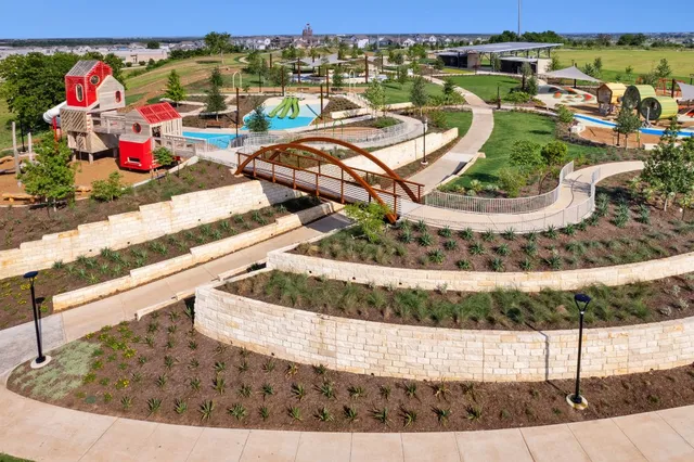 an aerial view of a house with a ocean view