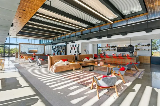 a view of a patio with swimming pool table and chairs