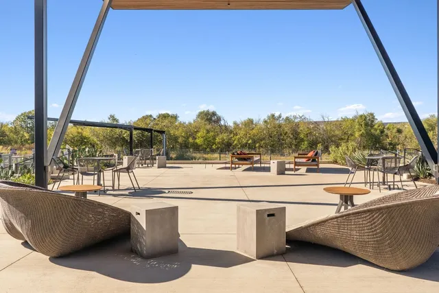 a view of a chairs and table in a patio