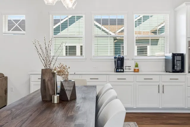 a kitchen with refrigerator and cabinets