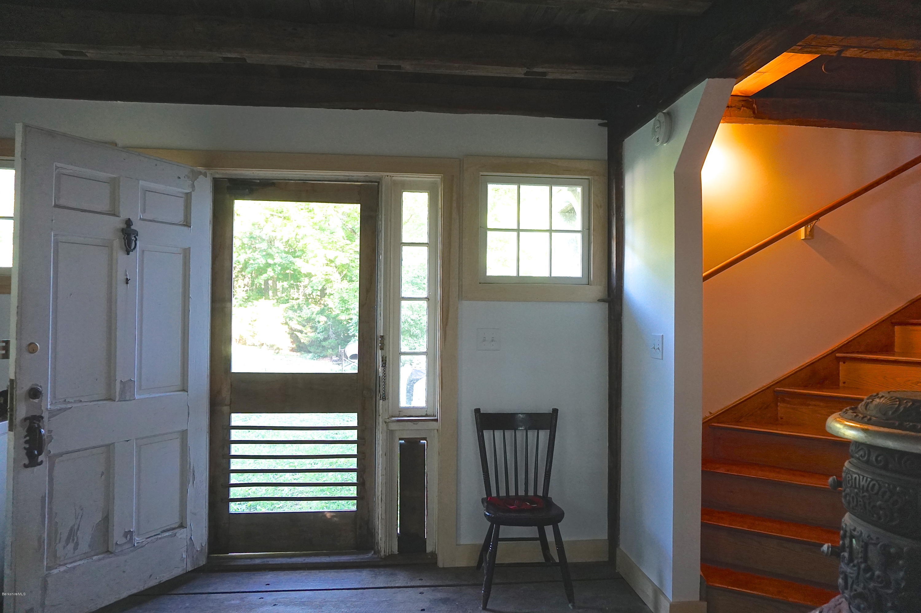 519 Main Road Monterey, MA 01245 - Photo 12 of 28 a view of a hallway with wooden floor and stairs