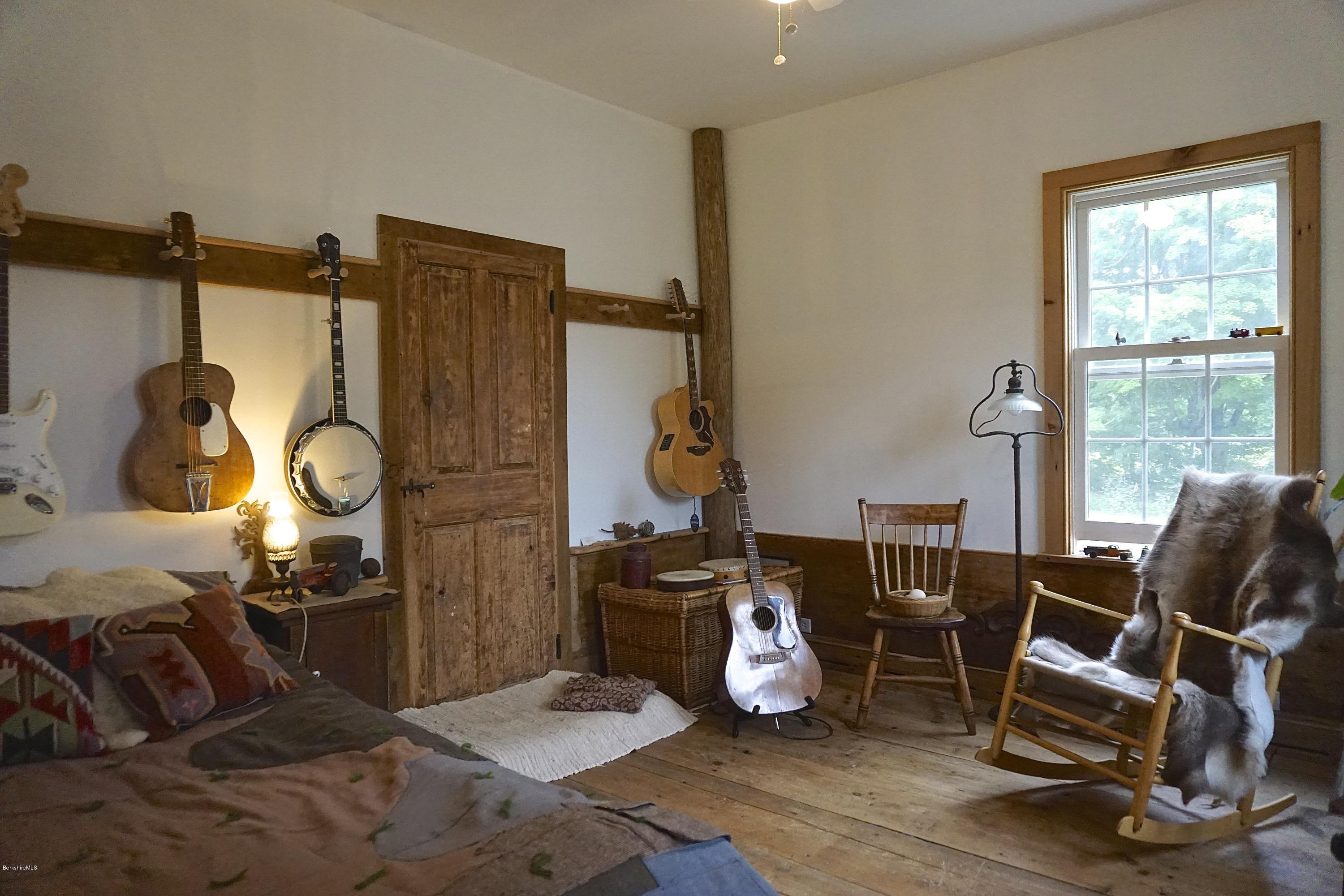 519 Main Road Monterey, MA 01245 - Photo 18 of 28 a room with furniture and a window
