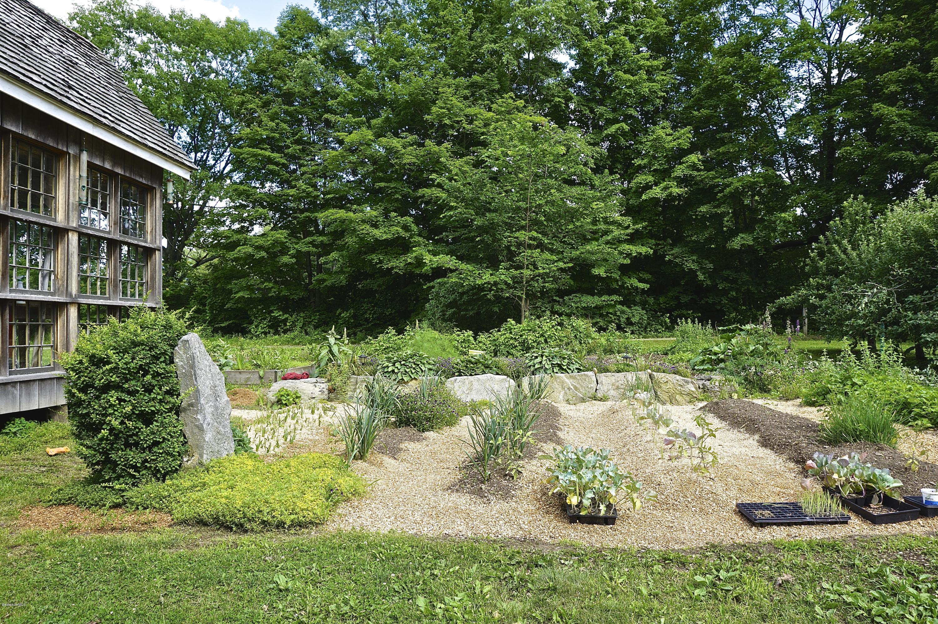 519 Main Road Monterey, MA 01245 - Photo 23 of 28 a backyard of a house with lots of green space