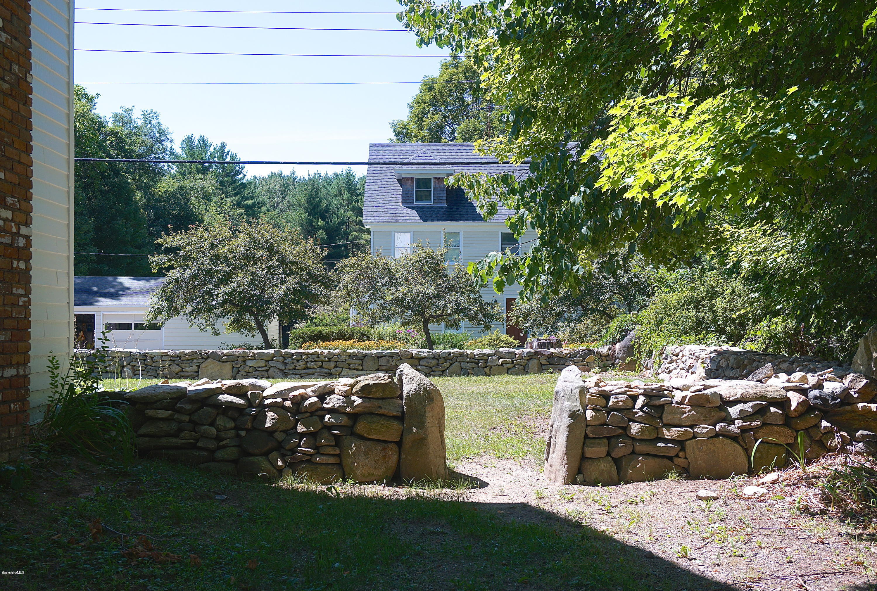 519 Main Road Monterey, MA 01245 - Photo 25 of 28 a view of a lake with a big yard