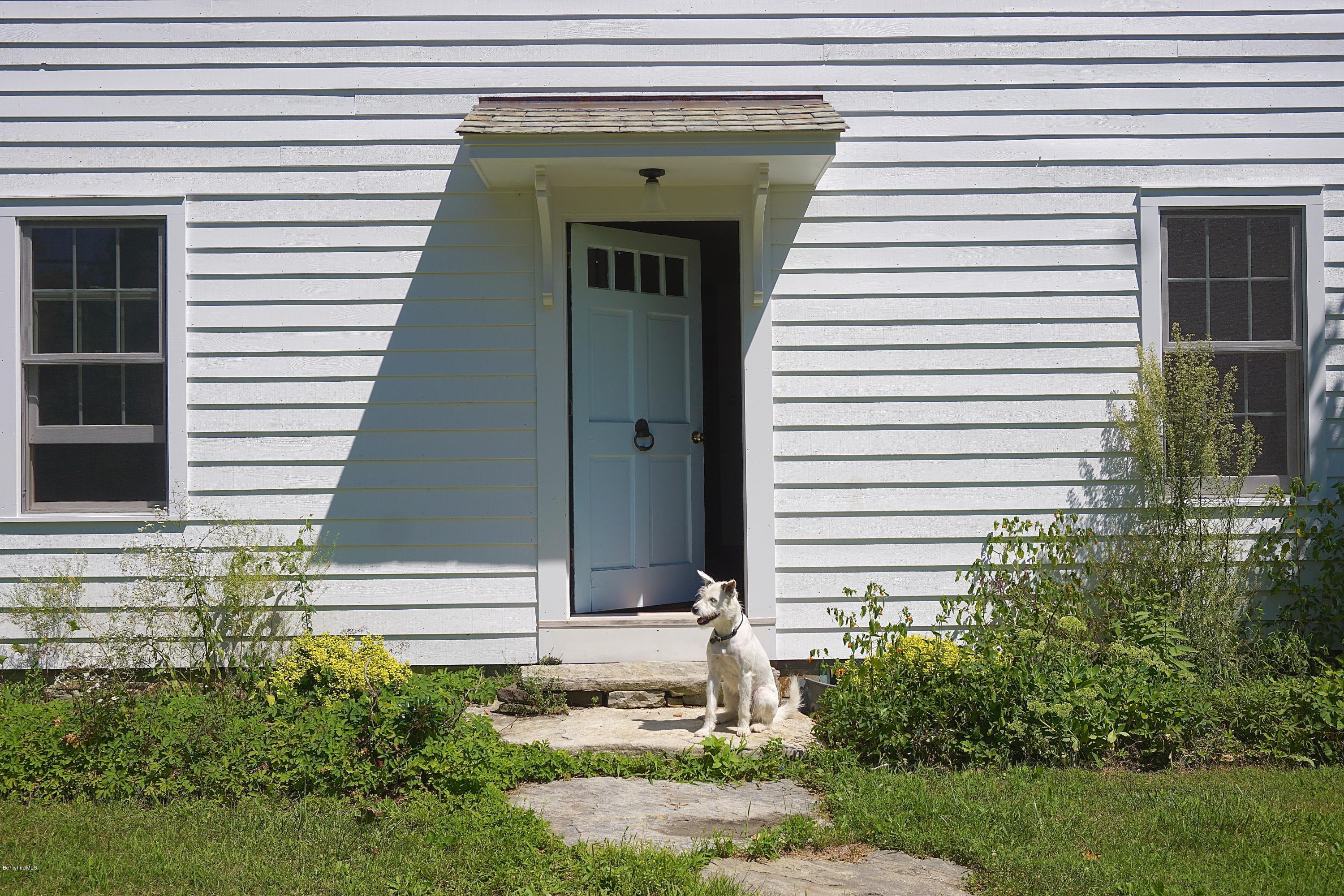 519 Main Road Monterey, MA 01245 - Photo 28 of 28 a front view of a house with a yard