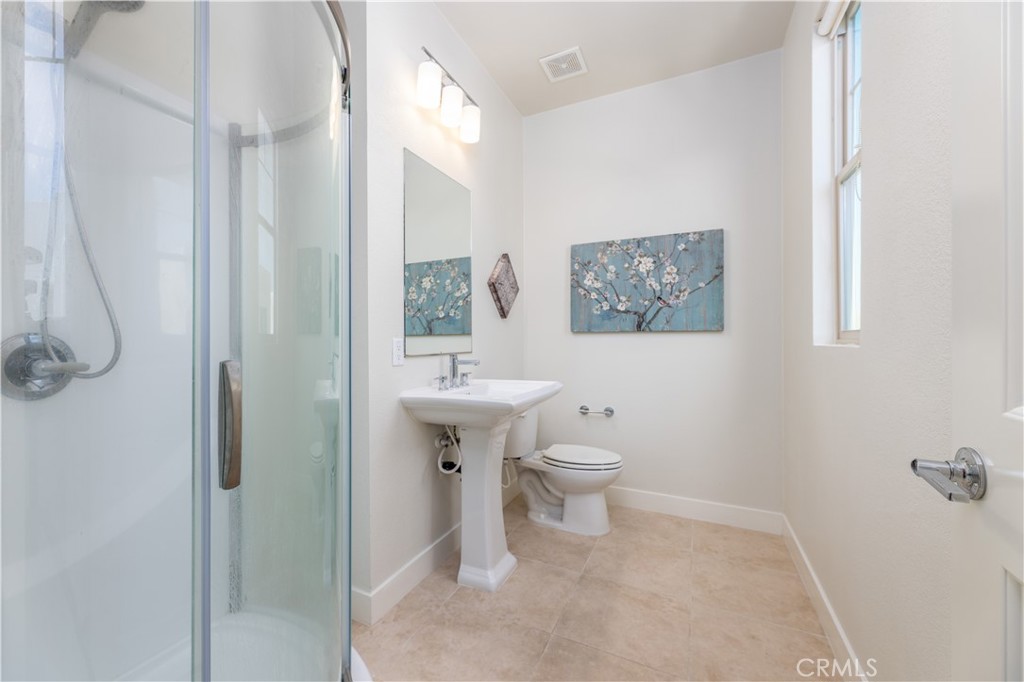 126 Interval Irvine, CA 92618 - Photo 28 of 47 a bathroom with a toilet sink and shower