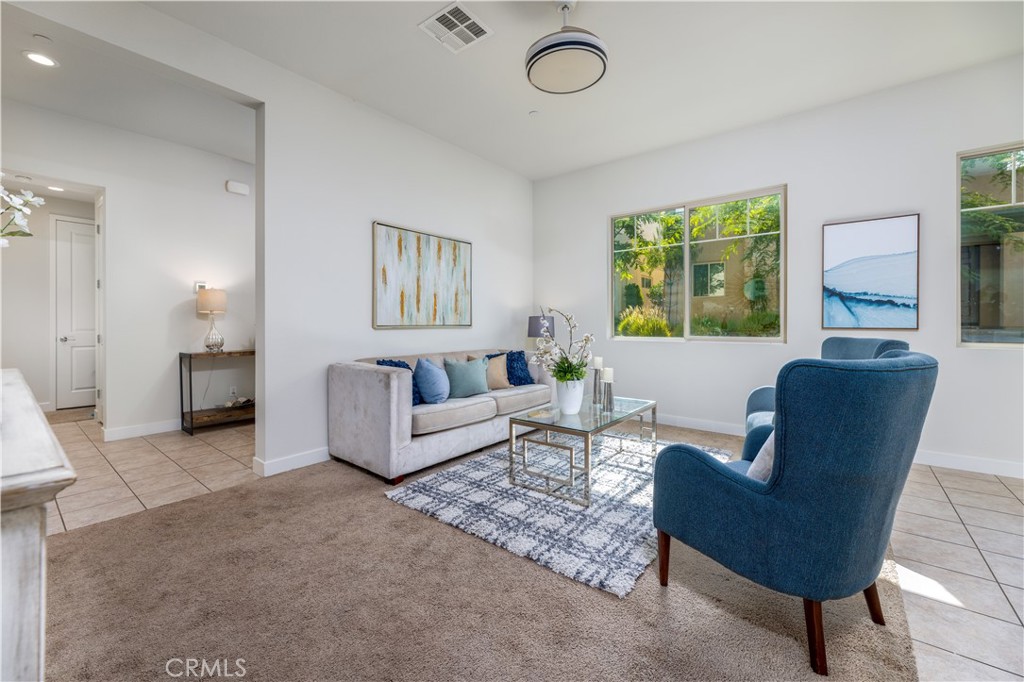 126 Interval Irvine, CA 92618 - Photo 8 of 47 a living room with furniture and a large window