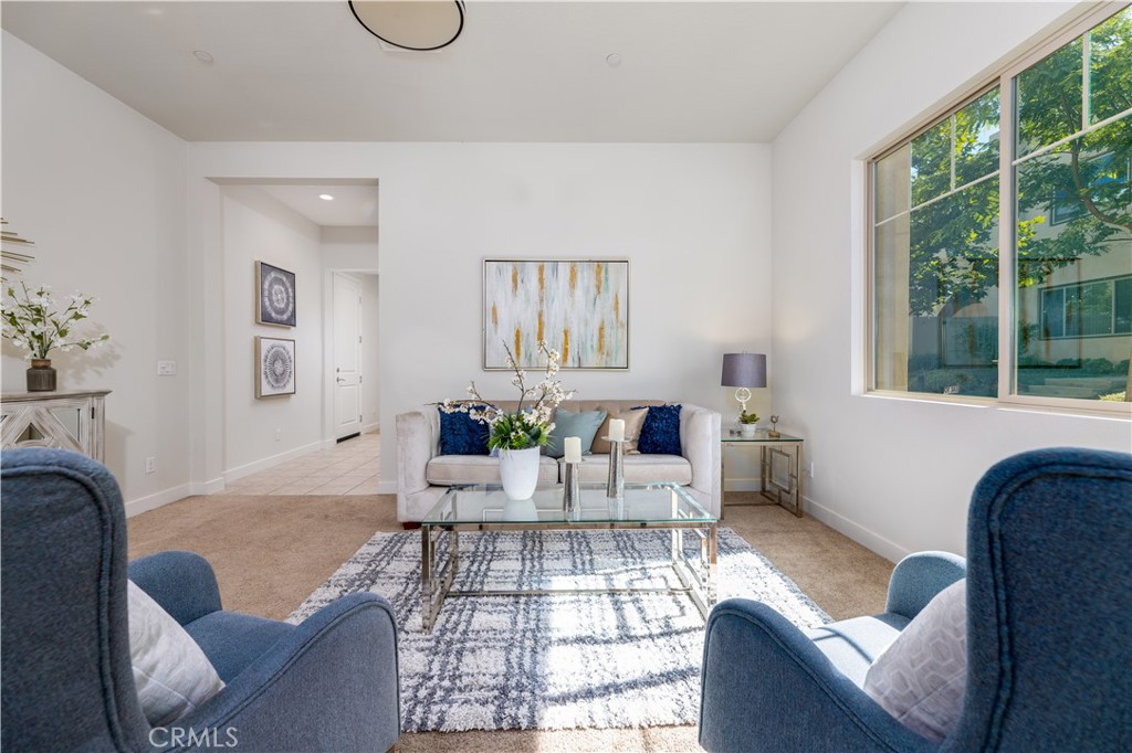 126 Interval Irvine, CA 92618 - Photo 9 of 47 a living room with furniture and a window