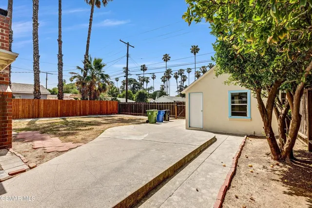 a view of a house with a small yard