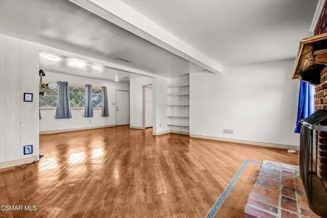 a view of an empty room and window