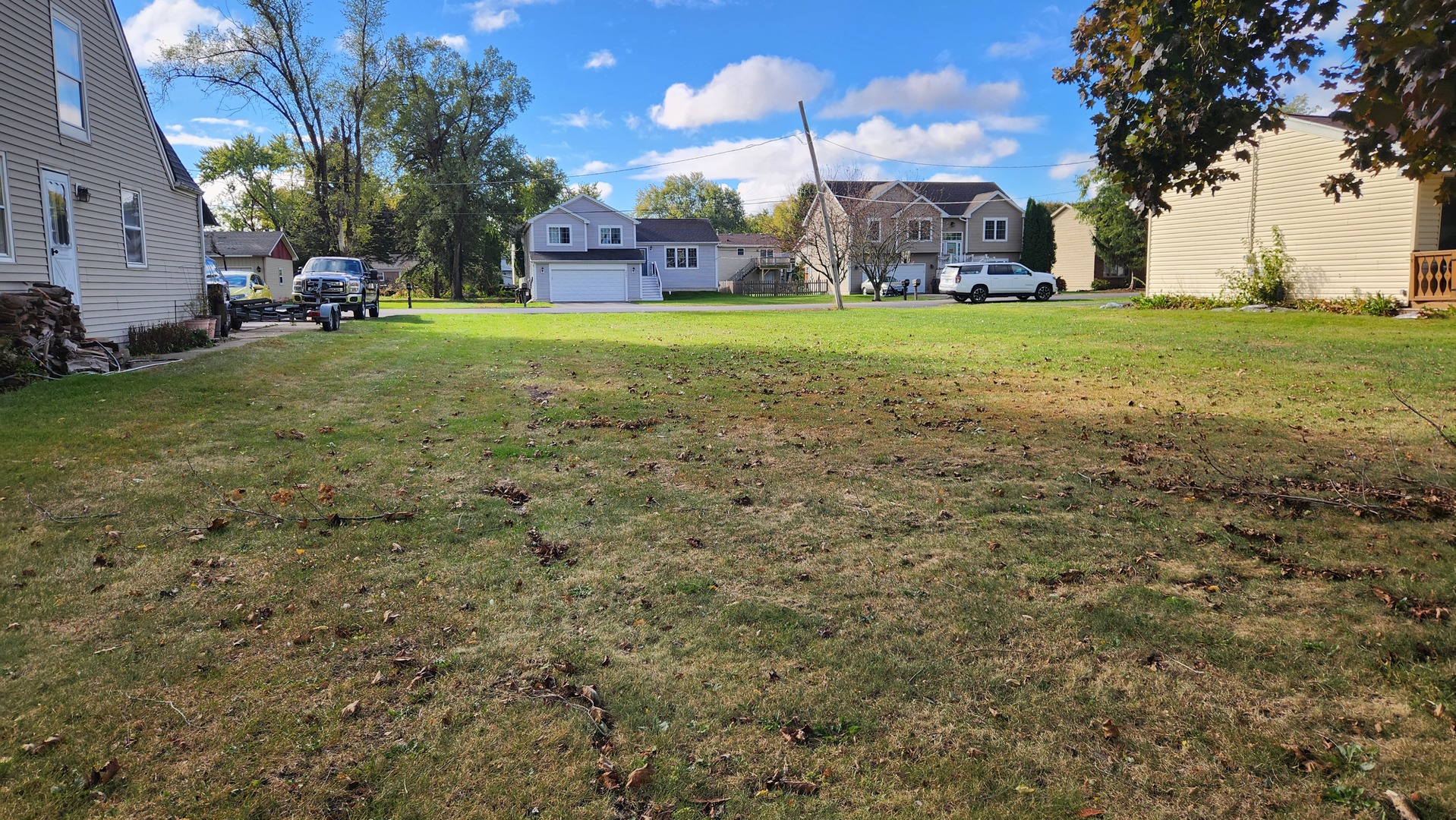 3010 Miller Drive McHenry, IL 60050 - Photo 8 of 10 a view of a big yard with a house in the background