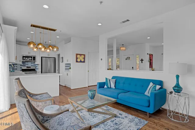 a view of balcony with wooden floor and fence