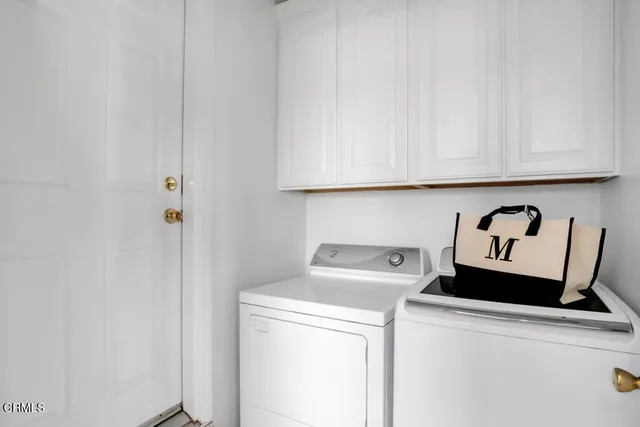a living room with furniture a piano and a window
