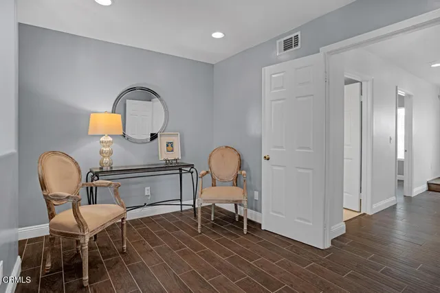 a bedroom with a bed and a night stand