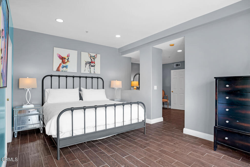 1300 Blue Hill Road Los Angeles, CA 90041 - Photo 26 of 54 a bedroom with a bed and wooden floor