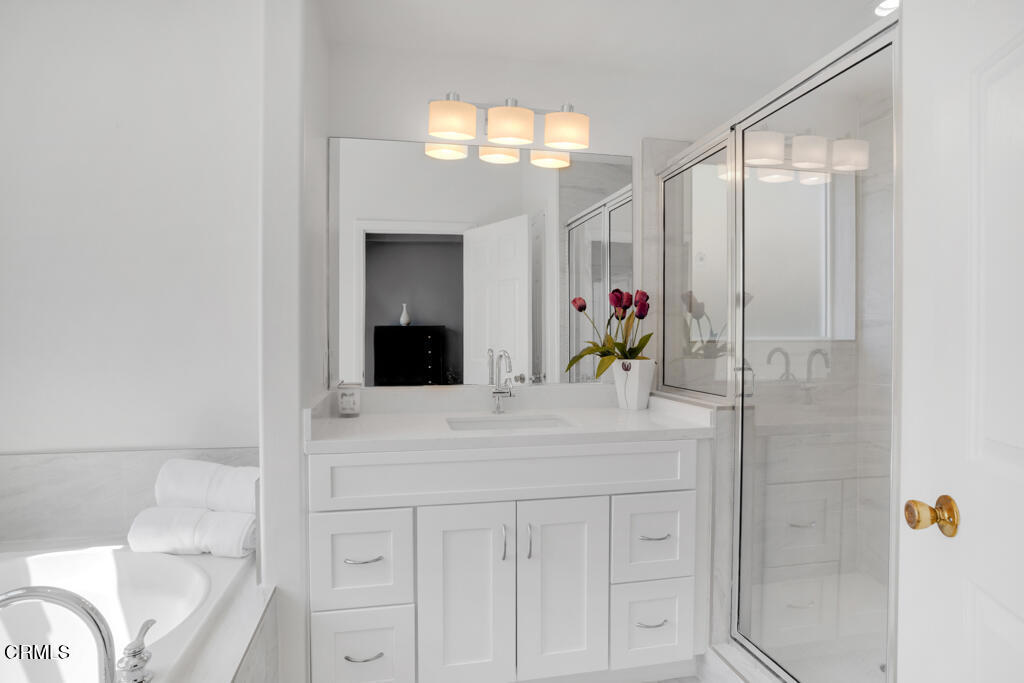 1300 Blue Hill Road Los Angeles, CA 90041 - Photo 28 of 54 a bathroom with a sink vanity mirror and shower