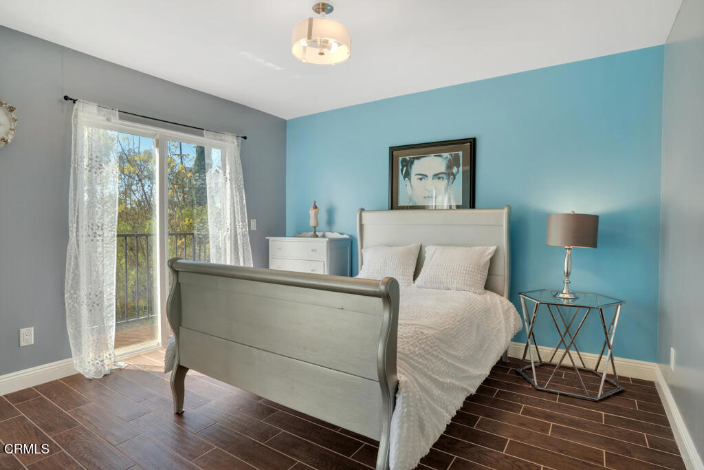 1300 Blue Hill Road Los Angeles, CA 90041 - Photo 32 of 54 a bed sitting in a bedroom next to a window