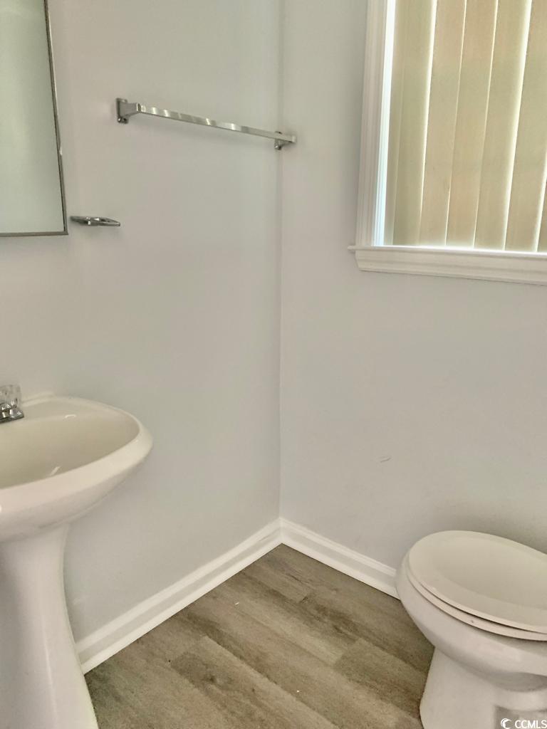 105 South Merriman Road, Unit 1 Georgetown, SC 29440 - Photo 3 of 22 Bathroom featuring baseboards and wood finished floors