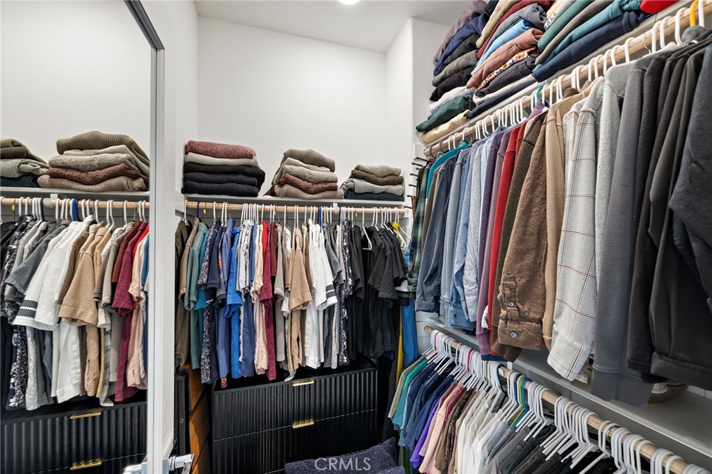 61 Wheelbarrow Road Rancho Mission Viejo, CA 92694 - Photo 18 of 74 a view of walk in closet with clothes and shoes