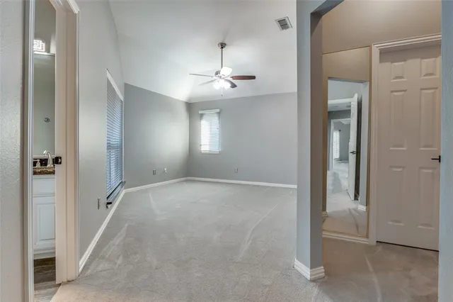 wooden floor in an empty room with a mirror