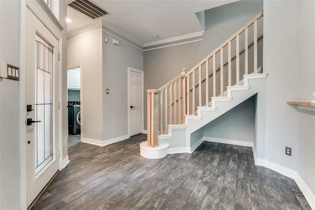 a view of entryway with wooden floor