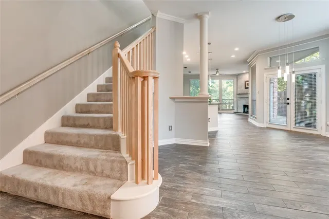 a view of entryway and hall with wooden floor