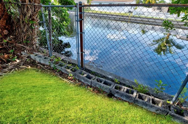 a view of a backyard with sitting area