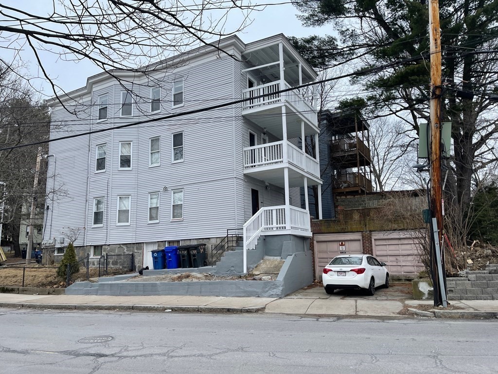 39 Glen Road Boston, MA 02130 - Photo 2 of 15 a car parked in front of a building