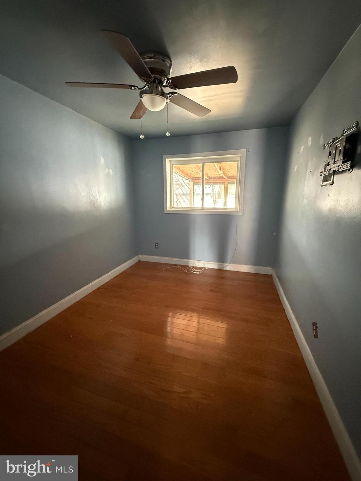 1841 South 28th Street Philadelphia, PA 19145 - Photo 6 of 9 an empty room with windows and fan