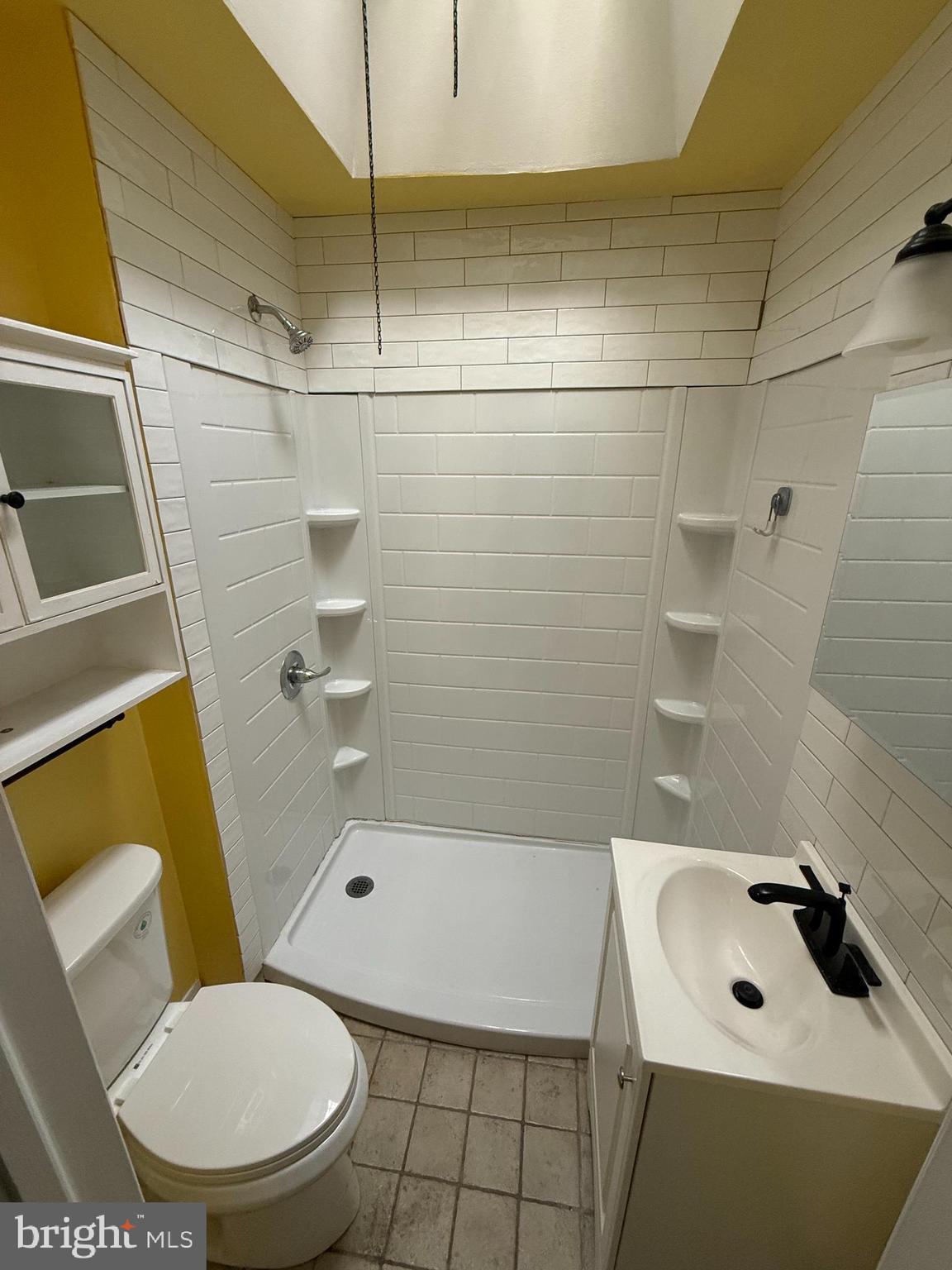 1841 South 28th Street Philadelphia, PA 19145 - Photo 9 of 9 a bathroom with a sink and a mirror