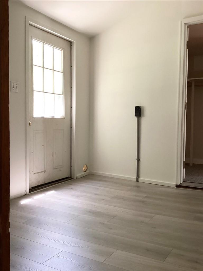 22 Hunns Lake Road Stanfordville, NY 12581 - Photo 16 of 36 a view of an empty room with wooden floor and a window