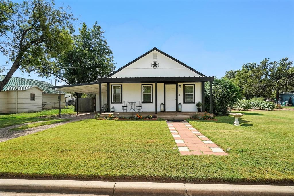 420 West D Street Munday, TX 76371 - Photo 1 of 1 a view of a house with swimming pool