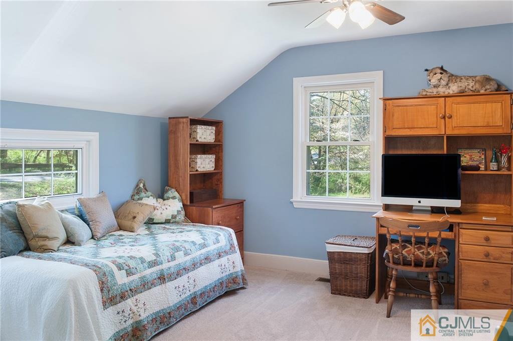 11 Mendham Road Far Hills, NJ 07931 - Photo 14 of 20 a bedroom with furniture and a flat screen tv