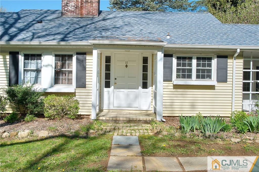 11 Mendham Road Far Hills, NJ 07931 - Photo 3 of 20 a front view of a house with garden