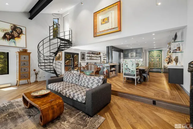 a large dining space with furniture a rug and a view of kitchen